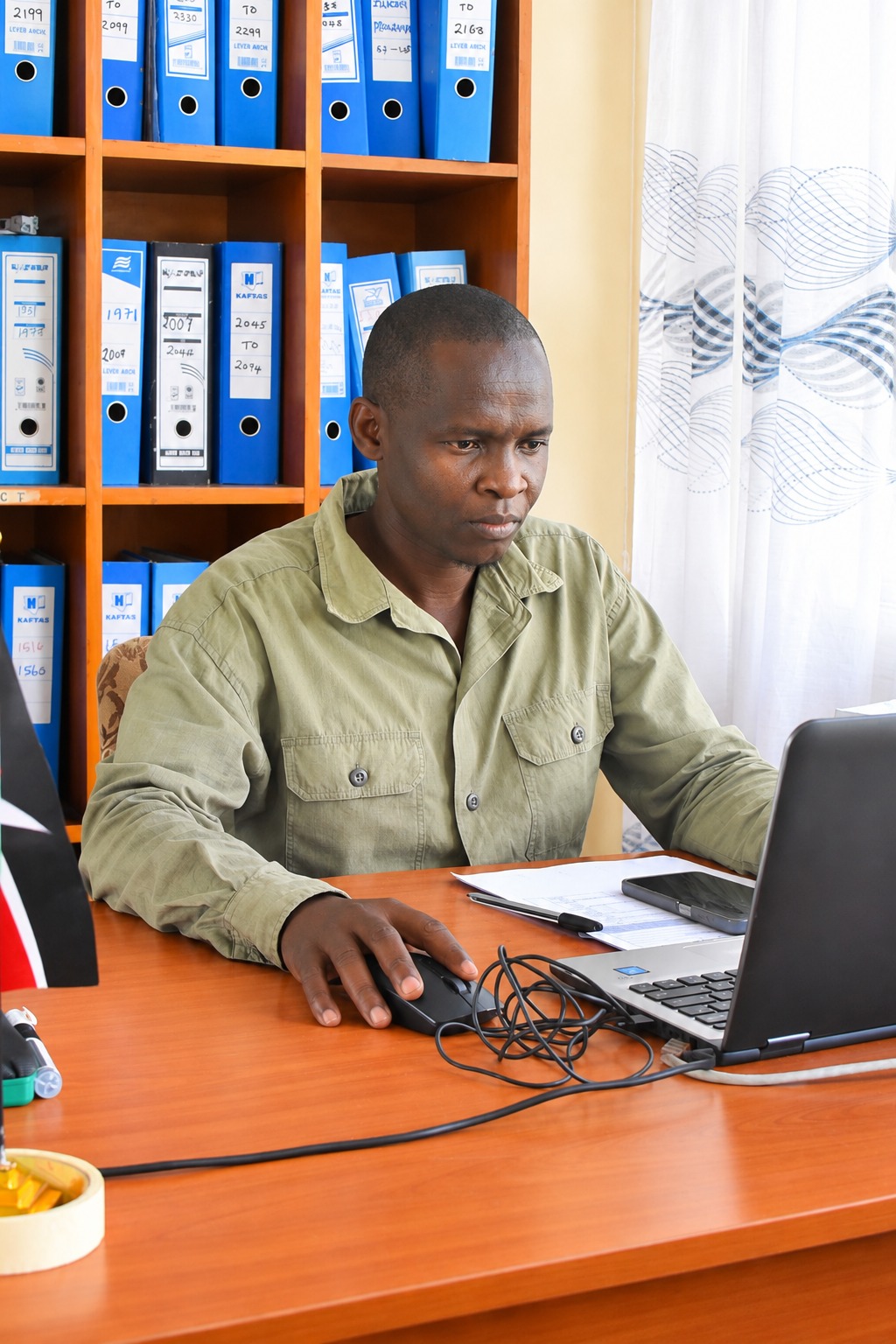 Assessment Officer working at a desk